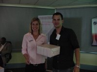 Ms Lecia Pocock (T-Systems SA (Pty)Ltd) handing over the prize to the lucky draw winner, Mr Zane Simpson(Stellebosch University) - proudly sponsored by T-Systems SA (Pty)Ltd