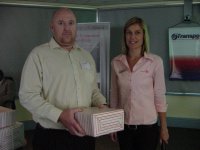 Ms Lecia Pocock (T-Systems SA (Pty)Ltd) handing over the prize to the lucky draw winner, Mr Edmond Victor(Optipro) - proudly sponsored by T-Systems SA (Pty)Ltd